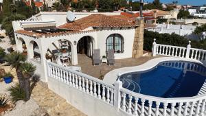 an aerial view of a house with a swimming pool at Villa Benitachell, La Cumbre del Sol in Benitachell