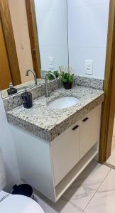 a bathroom counter with a sink and a mirror at FL04 - Decoração Moderna a 500m da Expo Center Norte in Sao Paulo