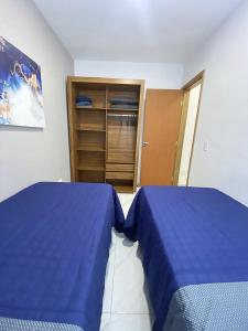 two beds sitting next to each other in a bedroom at FL04 - Decoração Moderna a 500m da Expo Center Norte in Sao Paulo +22 photos