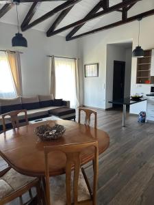 a living room with a table and a couch at Windmill Apartments in Galaxidi