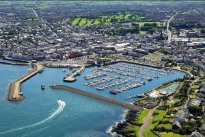 an aerial view of a marina with a boat in the water at Luxury Seaside Town House in Bangor