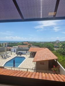 a view from the roof of a building with a swimming pool at Pousada Âncora in Conde