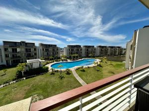 a view from a balcony of an apartment with a swimming pool at El Firmamento 36f in Mezcales +10 photos