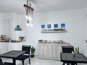 Kuchyň nebo kuchyňský kout v ubytování B&B I Colori Dell'Isola + 30 fotografií