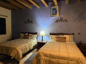 Postel nebo postele na pokoji v ubytování Macarena Guest House