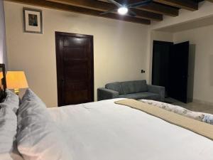 Postel nebo postele na pokoji v ubytování Macarena Guest House