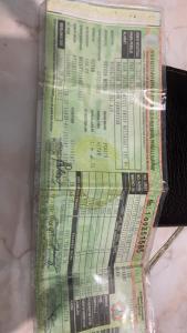 a stack of green tickets in a package at Sawi in Pamanukan