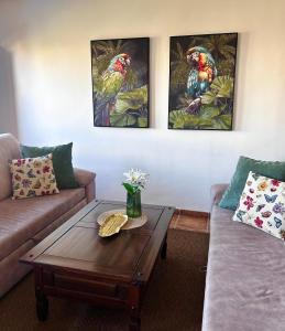 a living room with a couch and a coffee table at Apartamento La casa Verde in Punta Prima