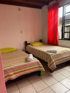 Postel nebo postele na pokoji v ubytování Hotel Campestre Casa Jaz