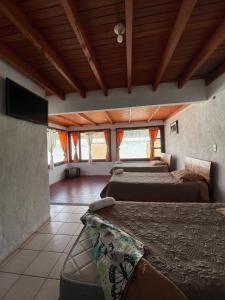 Postel nebo postele na pokoji v ubytování Hotel Campestre Casa Jaz