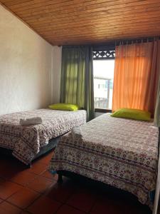 Postel nebo postele na pokoji v ubytování Hotel Campestre Casa Jaz