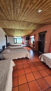 Postel nebo postele na pokoji v ubytování Hotel Campestre Casa Jaz