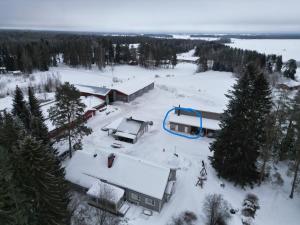 an aerial view of a house in the snow at Peltokankaan tila in Ylivieska