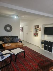 a living room with a couch and a table at Ferienwohnung mit Burgblick in Mayen