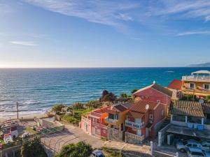 an aerial view of a beach with houses and the ocean at Charming Studio Just Steps from Paramonas Beach in Paramonas +21 photos