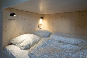 Postel nebo postele na pokoji v ubytování Tiny House im Allgäu