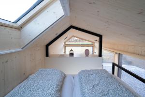 Postel nebo postele na pokoji v ubytování Tiny House im Allgäu