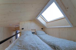 Postel nebo postele na pokoji v ubytování Tiny House im Allgäu
