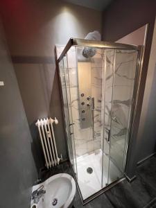 a bathroom with a shower and a sink at Anna Apartment in Padova