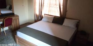 Postel nebo postele na pokoji v ubytování MT4 Hotel