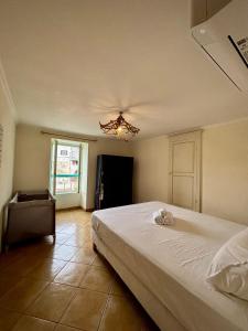 Giường trong phòng chung tại Casa Marelina - Maison de pêcheur port de Centuri