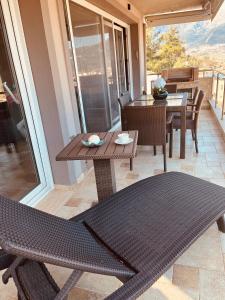 a patio with a table and chairs on a balcony at Golden Sea View -Thasos House in Skala Potamias