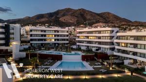 an aerial view of a hotel with a swimming pool at Higueron West Property Collection - La CostaVale by HWPC in Fuengirola