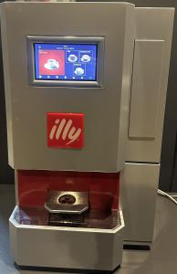 a krispy kreme machine with a tv on it at Lux Apartments in Pristina