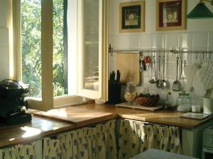 a kitchen with a counter top and a window at Villa Casa Rosa in Procchio