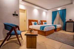 Postel nebo postele na pokoji v ubytování Pyramids Gem Plaza Hotel