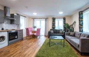 a living room with a couch and a table at Apartment with free P for Van. in Southampton
