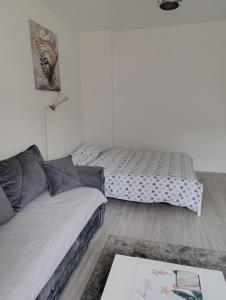 Postel nebo postele na pokoji v ubytování Smart Apartman