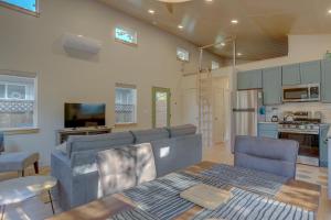 a living room with a couch and a table at Mod Pod in Bend