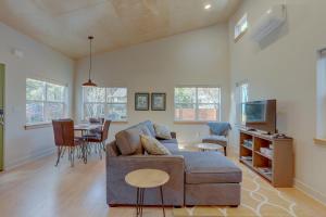 a living room with a couch and a table at Mod Pod in Bend