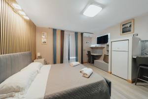 A bed or beds in a room at Catanese Proverb's House - Via Napoli - Ground Floor