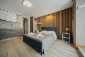 A bed or beds in a room at Catanese Proverb's House - Via Napoli - Ground Floor