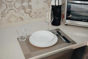 A kitchen or kitchenette at Catanese Proverb's House - Via Napoli - Ground Floor