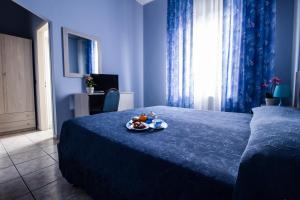 Postel nebo postele na pokoji v ubytování Miramare Hotel