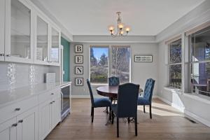 a kitchen with a dining room table and chairs at Flagline Trail in Bend +23 photos