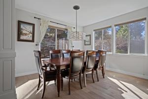 a dining room with a wooden table and chairs at Flagline Trail in Bend