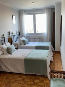 A bed or beds in a room at A CALZADA