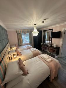 The Cambridge Guest House by Tas客房内的一张或多张床位