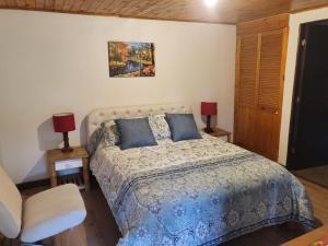 Postel nebo postele na pokoji v ubytování Hotel Cerro Fuerte