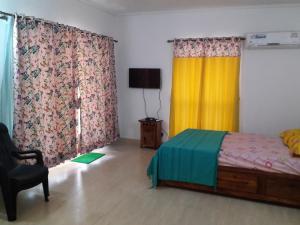 Ένα ή περισσότερα κρεβάτια σε δωμάτιο στο Studio and One bedroom Apartment in Riviera Sapphire, Siolim