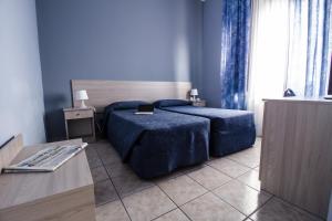 Postel nebo postele na pokoji v ubytování Miramare Hotel