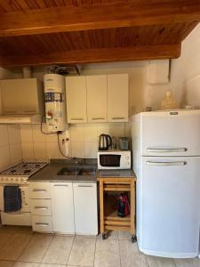 Kuchyň nebo kuchyňský kout v ubytování Departamento cerca de Parque San Martín + 8 fotografií