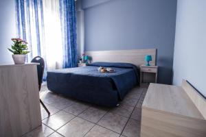 Postel nebo postele na pokoji v ubytování Miramare Hotel