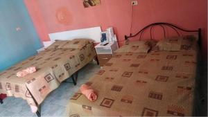 Postel nebo postele na pokoji v ubytování Residencial D' Caché