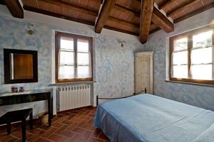 A bed or beds in a room at La Casetta nel Bosco