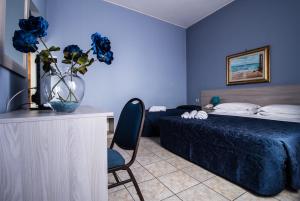 Postel nebo postele na pokoji v ubytování Miramare Hotel